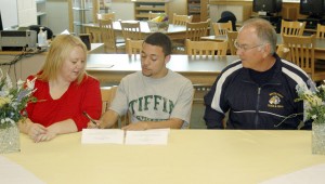 Mitchell signs