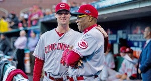 Cincinnati outfielder Ryan Ludwick (left) puts his arm around manager Dusty Baker during a playoff game last season. Baker suffered a mild stroke last year and has altered his lifestyle for health reasons. (The Tribune / MCT Direct Photos)