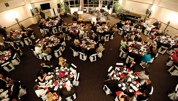 Attendees of the Ohio University Southern Dean’s Gala listen as Dr. Roderick J. McDavis, president of Ohio University talks about the school, its future and recent successes.
