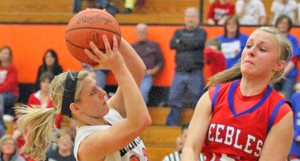 Ironton Lady Fighting Tigers’ Alicia Murphy drives inside against Peebles’ Taylor Brown during the fourth quarter of Thursday’s Division III district semifinals. Ironton won 37-34 to reach the district finals against Adena at 2 p.m. Sunday, March 3, at Ohio University. (Courtesy Tim Gearhart of Tim’s News & Novelties  of Ironton)