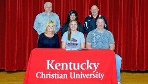 Rock Hill Redwomen senior Tommi Butler signed a letter-of-intent to play volleyball at Kentucky Christian University. Attending the ceremony were: seated from left to right, mother Brenda, Tommi and father Robert; standing from left to right, athletic director Bob Wilds, Redwomen head coach Mary Ferguson and KCU head coach Bruce Dixon. (Kent Sanborn of Southern Ohio Sports Photos.com)