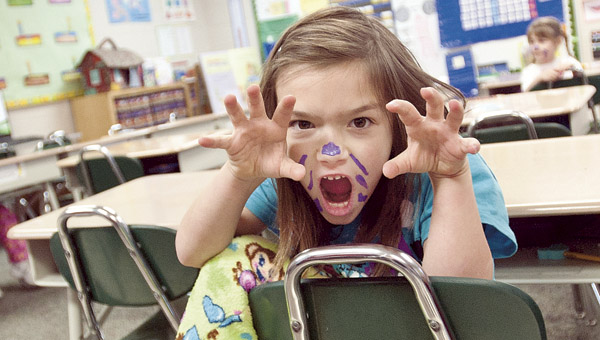 Audrey Clark, in her pajamas, gives a scary cat face during Dr. Seuss Day at Fairland East Elementary.