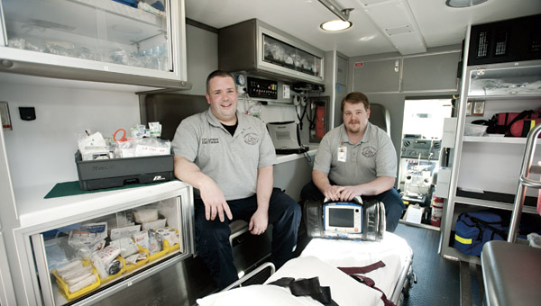 Partners Pete Lunsford and David Zornes are seen inside one of the Lawrence County Emergency Medical Services ambulances.