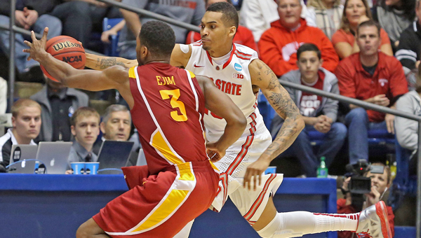 Ohio State Buckeyes forward LaQuinton Ross (10) saves a ball from going out against Iowa State Cyclones forward Melvin Ejim (3) during the second half of a third-round game in the NCAA Tournament at Dayton Arena in Dayton on Sunday. Ohio State defeated Iowa State, 78-75. (MCT Direct Photo)