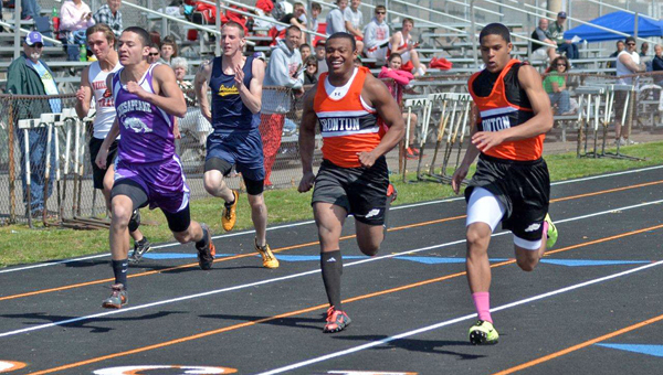 Ironton’s Patrick Lewis (center) is all smiles but his teammate Jake Long (right) was even happier after winning the 100-meter dash at the 60th Ironton Invitational track meet on Saturday. Chesapeake’s Javon Thompson (left) finished second. (Kent Sanborn of Southern Ohio Sports Photos.com)