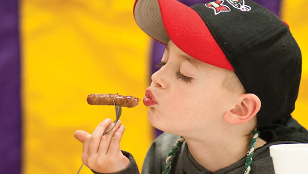 ive-year-old Landon Kimbler enjoys his breakfast at the Coal Grove Lions Club Pancake Breakfast Saturday at Dawson-Bryant High School.