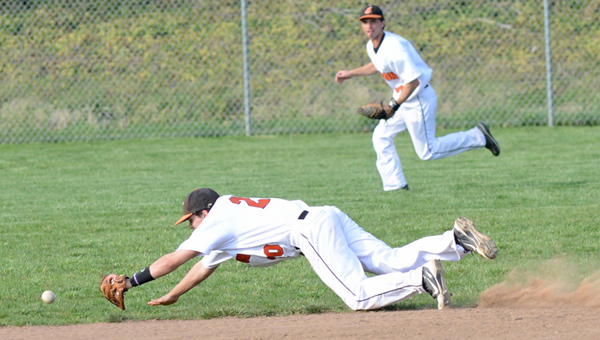 Ironton Fighting Tigers’ shortstop Luke Diamond makes a diving stop of a ground ball during Tuesday’s 4-0 win over Portsmouth. Outfielder Korey Kellogg backs up the play. (Tony Shotsky of Southern Ohio Sports Photos.com)