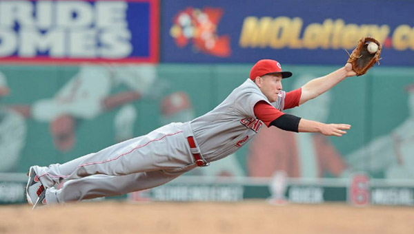 Cincinnati Reds’ third baseman Todd Frazier makes a diving stop of a ground ball hit by St. Louis’ Yadier Molina and throws him out at first base. Frazier played well defensively but was 0-for-11 at the plate in the series. The Reds lost 10-0 on Wednesday to the Cardinals. (Photo Courtesy of the Cincinnati Reds.com)