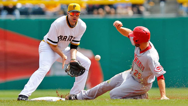 Cincinnati outfielder Chris Heisey (28) steals second base ahead of the tag by Pittsburgh’s Neil Walker. Heisey’s effort was wasted as the Reds lost their fifth straight game on Sunday, 10-7. (Courtesy of the Cincinnati Reds.com)