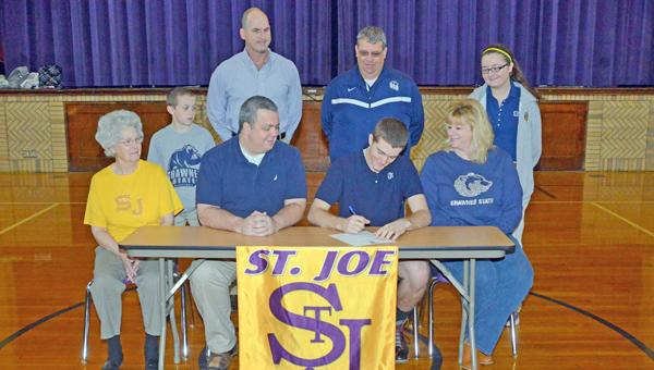 St. Joseph Flyers’ senior goalkeeper Justin Mahlmeister signed a letter-of-intent to play for the Shawnee State University Golden Bears. Attending the ceremony were: seated from left to right, grandmother Wanda Mahlmeister, father Jimmy Mahlmeister, Justin, and Melanie Mahlmeister; standing from left to right, brother Jimmy, St. Joseph head coach Tim Hopkins, Shawnee State assistant coach Mark Trapp, and sister Morgan. (Tony Shotsky of Southern Ohio Sports Photos.com)