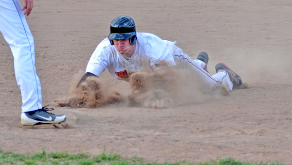 Ironton Fighting Tigers’ Aaron Stephens kicks up the dirt as he does a head-first slide into third base. Stephens had two hits and scored three runs as Ironton beat Green 12-2. (Kent Sanborn of Southern Ohio Sports Photos.com)
