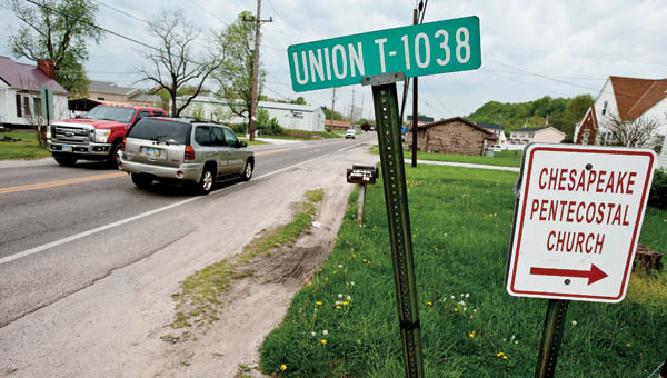 Traffic passes back and forth along Old U.S. 52 outside of Chesapeake Wednesday morning. The Village of Chesapeake is looking to extend the village line to the Lawrence County Airpark.