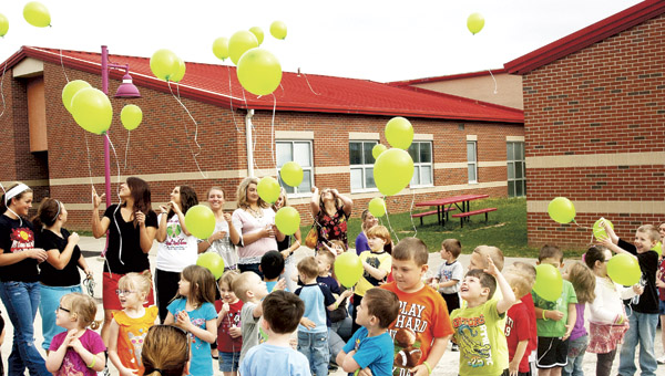 Preschool children at Rock Hill release balloons into the air Monday for the start Week of the Young Child.