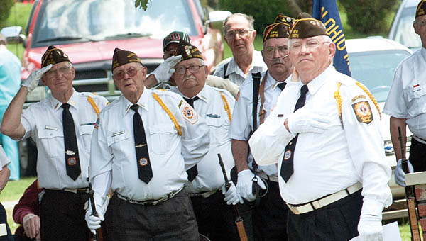 Members of the VFW 6878, of Proctorville, stand at attention during the Pledge of Allegiance during a special recognition of Armed Forces Day Saturday.