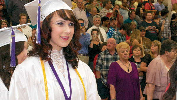 Chesapeake High School students look on as the rest of their class walk down to be seated before crossing the stage as graduates at the school’s commencement exercise Saturday evening.