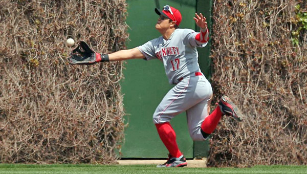 Cincinnati Reds’ centerfielder Shin-Soo Choo runs as he attempts to catch a ball hit by the Chicago Cubs’ David DeJesus during Sunday’s game in Chicago. The Reds won 7-4. (Photo Courtesy of The Cincinnati Reds.com)