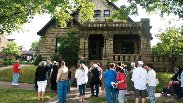 Eventgoers gather in front of 504 S. Fifth St. at the former home of irontonmaster Nanny Kelley Wright.