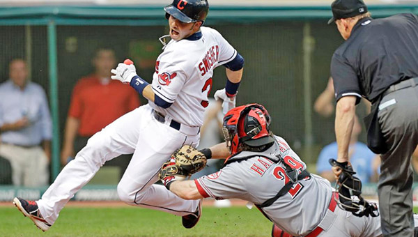 Cincinnati Reds’s catcher Ryan Hanigan tags out Cleveland’s Nick Swisher trying to score on a double by Jason Giambi during the fourth inning of Wednesday’s game. The Reds lost 5-2 to the Indians to end their five-game winning streak. (Photo Courtesy of The Cincinnati Reds)