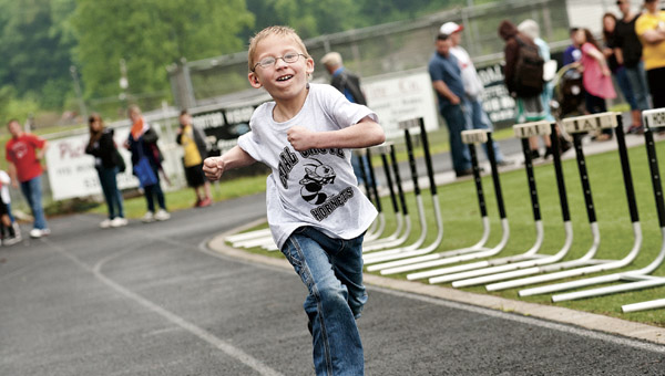 Dawson-Bryant Elementary School student Levi Kingery competes in the 50 meter dash during the Lawrence County Special Olympics Wednesday at Dawson-Bryant High School.