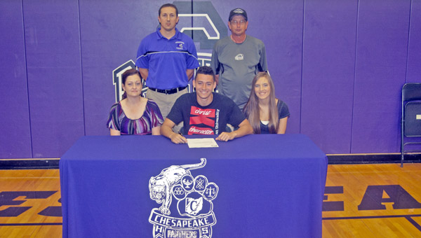Chesapeake Panthers’ senior Javon Thompson signed a letter-of-intent to play football at Kentucky Christian University. Attending the signing ceremony were: seated from left to right, mother Tara Thompson, Javon and friend Kierra Kerns; standing from left to right, Chesapeake head coach Andy Clark and football statistician Rusty Marcum. (The Ironton Tribune / Jimmy Walker)