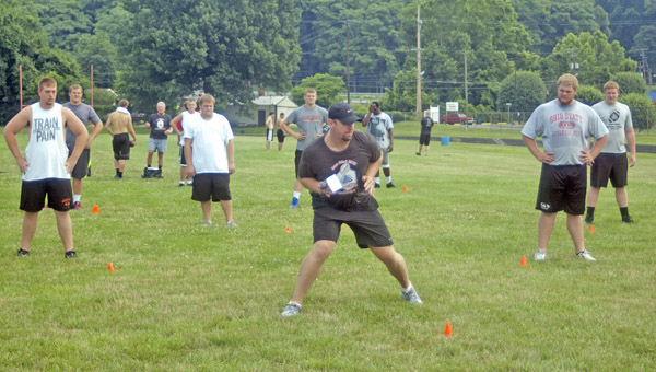 Former Ironton All-Ohio and Clemson All-America lineman Roman Fry instructs players at the third annual Preferred Fitness High School Football Combine on Saturday. Fry also served as the guest speaker. (The Ironton Tribune / Jimmy Walker)