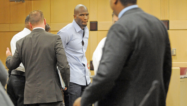 Court bailiffs hand cuff former Miami Dolphins wide receiver Chad Johnson after he was sentenced to 30 days in jail for a pat on his attorney's butt Monday in Fort Lauderdale, Fla. Johnson was in court on a probation violation charge and had worked out a plea deal with prosecutors that would have kept him out of jail. Broward Circuit Judge Kathleen McHugh, however, rejected the plea deal after Johnson playfully patted his lawyer, Adam Swickle, during the proceedings. (MCT DIrect Photo)