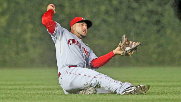 Cincinnati Reds left fielder Xavier Paul (26) makes a catch on a fly out by Chicago Cubs second baseman Darwin Barney (15) during the fifth inning at Wrigley Field in Chicago on Monday. The Reds won 6-2. (MCT Direct Photos)