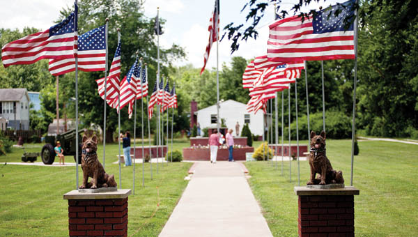 Visitors stop to check out the Southeast Ohio War Memorial in Proctorville Friday before the start of a Flag Day ceremony presented by the Proctorville VFW 6878.