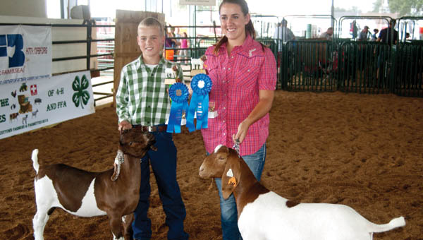 Dylan Back and C.J. Spears show off their trophies for taking top junior and senior showmanship honors.