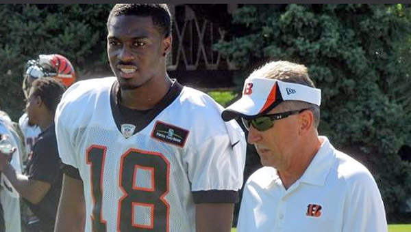 Cincinnati Bengals’ wide receiver A.J. Green (left) walks off the practice field at training camp after he suffered a twisted knee while attempting to make the catch of a deflected pass. (Photo Courtesy of The Cincinnati Bengals)