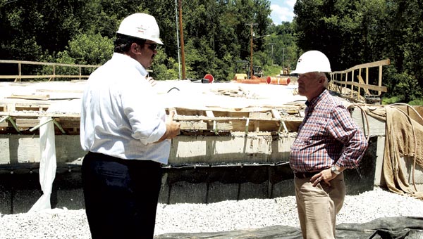 Rep. Bill Johnson (R-6) and Lawrence County Engineer Doug Cade, left, look over the progress at the County Road 22 bridge replacement project on Monday.