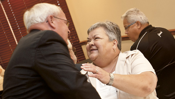 Clement is given a goodbye hug by Dan Mooney.