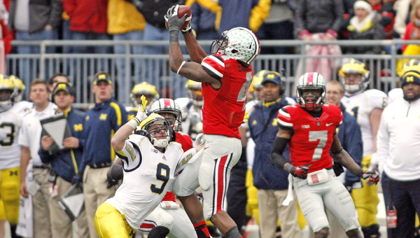 Ohio State's C.J. Barnett (4) intercepts a pass intended for Michigan's Drew Dileo (9) during last season. Barnett and the other Buckeyes are expecting a tough week of practice. (MCT Direct Photo)