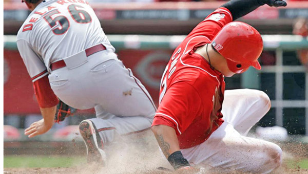 Cincinnati’s Shin-Soo Choo slides safely into home plate on a wild pitch to score the winning run as the Reds beat the Arizona Diamondbacks 2-1 on Thursday. (Photo Courtesy of The Cincinnati Reds)