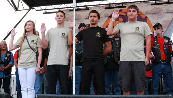 our local teenagers took the oath of enlistment Saturday during the Vietnam Veterans Tribute. This was part of the annual Parade of Heroes that included hundreds of motorcycles and veterans who came to show their respect for their fallen brothers and sisters.