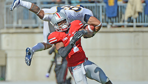 Ohio State defensive back Bradly Roby upends California Golden Bears running back Isi Sofele (20) during a game last season. Roby has been suspended along with two other players for the Buckeyes’ opening game Aug. 31 against Buffalo. (MCT Direct Photo)