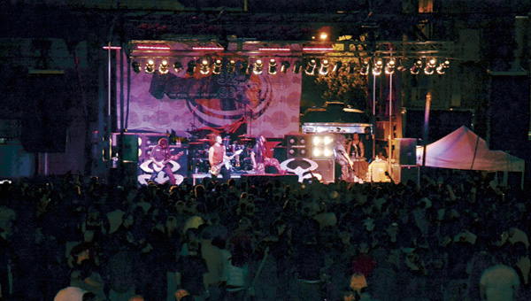 The band Nonpoint performs for hundreds of people in downtown.