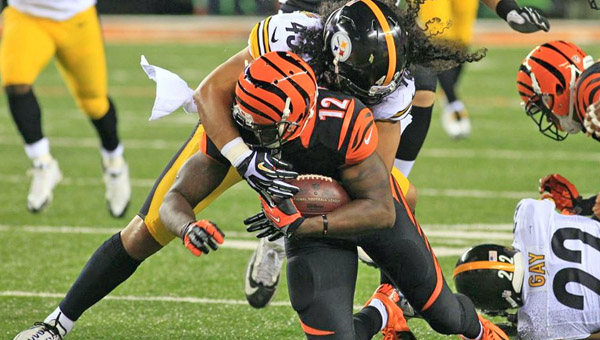 Cincinnati wide receiver Sanu Mohamed (12) is brought down by Pittsburgh Steelers’ safety Troy Polamalu after a big gain during Monday’s NFL game at Paul Brown Stadium in Cincinnati. The Bengals won 20-10. (Photo Courtesy of The CIncinnati Bengals.com)