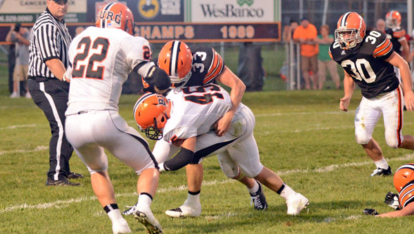 Ironton Fighting Tigers’ linebacker Jeremy Bodmer (33) brings down Wheelersburg running back Micah McAlister (45). Ironton hosts Russell on Friday. (Tony Shotsky of Southern Ohio Sports Photos)
