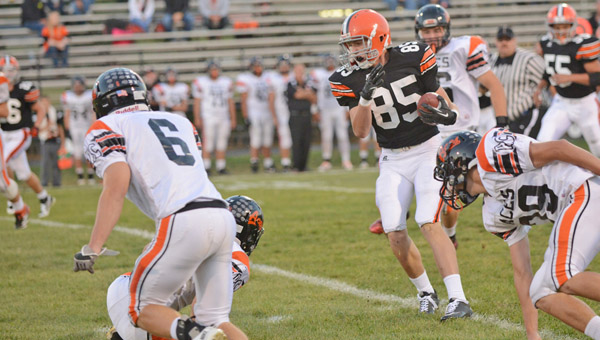Ironton Fighting Tigers’ tight end Lucas Campbell runs with the ball after making a catch against Amanda-Clearceek last week. Campbell’s catch went for 18 yards in a 14-7 win. (Tony Shotsky of Southern Ohio Sports Photos)
