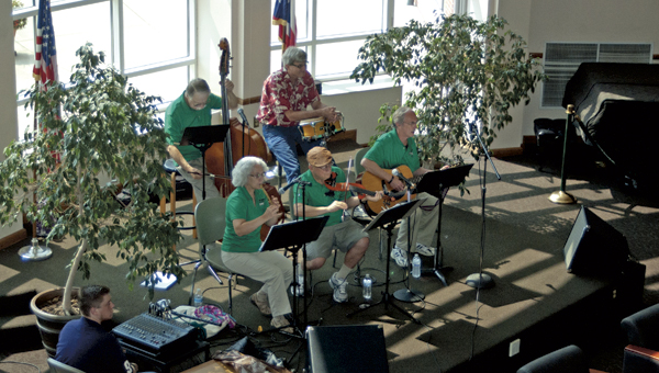 Kelley’s Bridge Band performs on Wednesday, during the Brown Bag Concert Series at the Riffe Center Mains Rotunda on the campus of Ohio University Southern on Wednesday. The series takes place from noon to 1 p.m. every Wednesday until Oct. 16. Pictured is Kelley’s Bridge Band members Christine Hunt, Bruce Brown, Rod Erwin, Herb “Hub” Rose and OUS fine arts instructor Pat McCoy sitting in on drums.