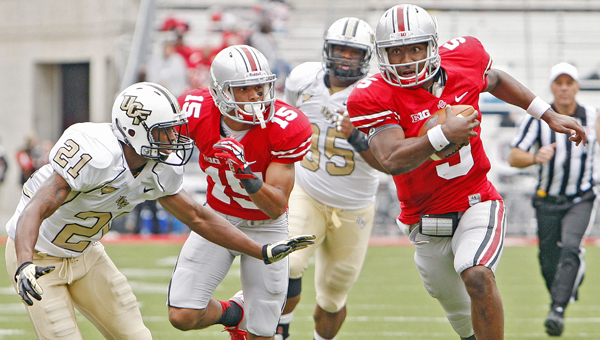 Ohio State Buckeyes' quarterback Braxton Miller (5) is listed as "day to day" with a sprained knee injury he suffered last Saturday in a win over San Diego State. (MCT Direct Photo)
