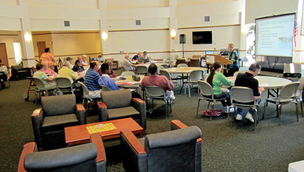 AARP Ohio volunteer Ann Lemley gives a presentation about the Affordable Care Act, also known as Obamacare, in the Riffe Center Mains Rotunda at Ohio University Southern. Open enrollment for the Affordable Care Act begins Tuesday.