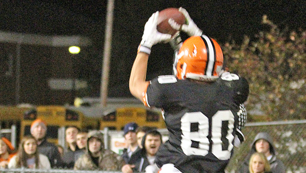 Ironton Fighting Tigers’ receiver Joe Bowling (80) goes up in the air over an Oak Hill defensive back to snag the winning touchdown pass from Tristan Cox with 25 seconds to play. The score gave Ironton a 20-14 win over Oak Hill on Friday. (Courtesy of Tim Gearhart of Tim’s News & Novelties in Ironton)