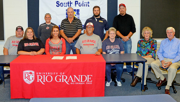 South Point Lady Pointers’ senior softball standout Katelyn Brown signed a letter of intent to play next fall at the University of Rio Grande. Attending the signing ceremony were: seated from left to right, parents Robert and Angie Black, Katelyn, grandparents Mike and Kathy Payne and Debbie and Jim Brown; standing from left to right, Rio Grande head coach Kristen Bradshaw, K.C. Diamond team coach Tony Ellis, South Point head coach Tanner Heaberlin and K.C. Diamond team coach Barry Powell. (Kent Sanborn of Southern Ohio Sports Photos)
