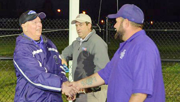 Former Chesapeake head football coach Phil Davis (left) is congratulated by Steve Alley after he announced the Panthers’ football field has been named in Davis’ honor. (Tony Shotsky of Southern Ohio Sports Photos)