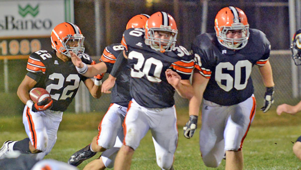 Ironton Fighting Tigers’ running back D’Angelo Palladino (22) follows the blocking of Trevor Easterling (30), Justin Robinson (60) and Tristan Cox (8) on a sweep as he gains some of his 138 yards in last week’s game against Johnson Central. Ironton plays at Columbus St. Charles Friday. (Tony Shotsky of Southern Ohio Sports Photos)