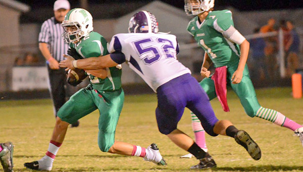 Fairland Dragons’ senior running back Evan Maddox (left) runs for some of his 149 yards as Chesapeake’s Austin Carpenter attempts to bring him down. The Dragons used a big second half to win 58-20. (Tony Shotsky of Southern Ohio Sports Photos)