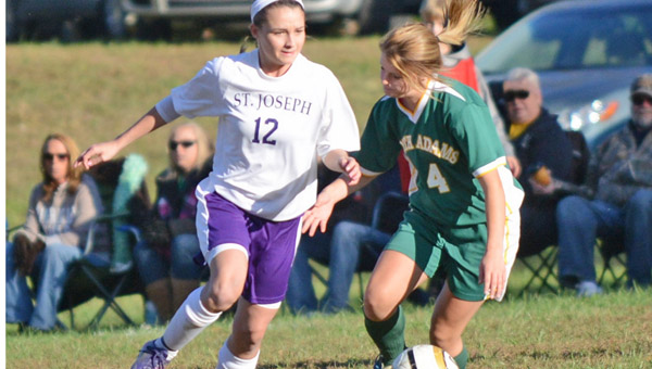 St. Joseph Female Flyers’ Sidney Payne pushes the ball upfield during Tuesday’s Division III sectional soccer game. The Female Flyers beat North Adams 5-4 in overtime reach the district. (Tony Shotsky of Southern Ohio Sports Photos)