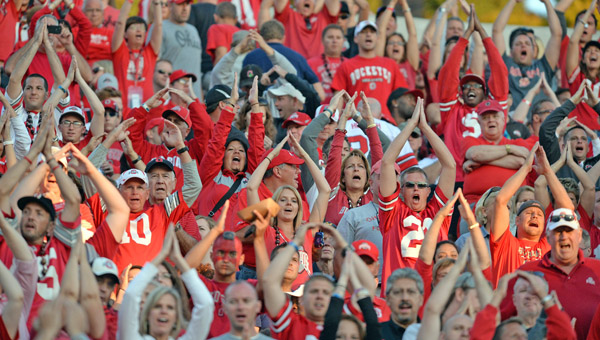 Ohio State Buckeyes’ football fans cheer for their team during the games, but they express frustration afterwards with the BCS playoff system that may leave their team out of the championship game. (MCT Direct Photos)